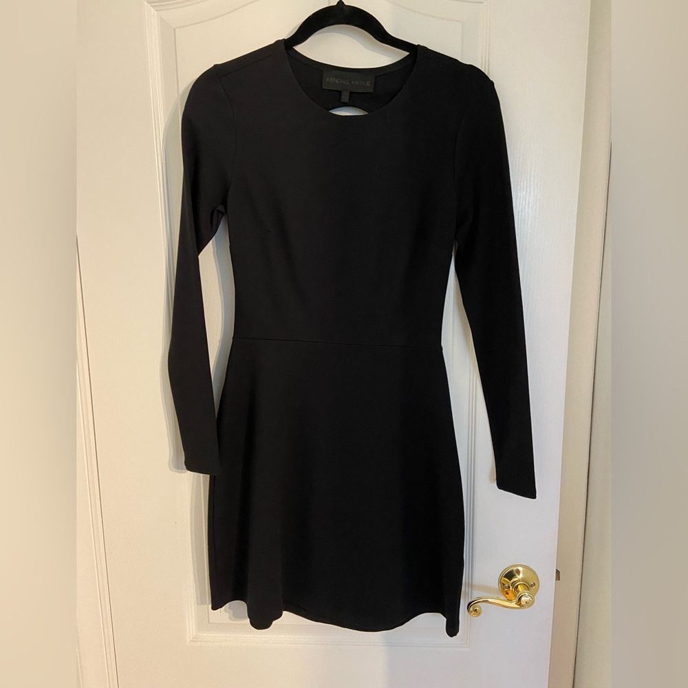 Long sleeve black mini dress with open back!
